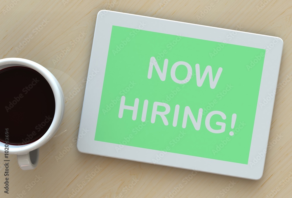 NOW HIRING, message on tablet and coffee on table NOW HIRING, message on tablet and coffee on table