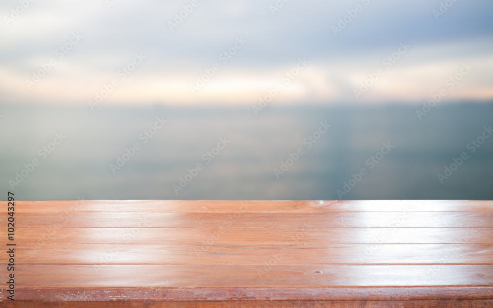 Old empty wooden table top with sea background