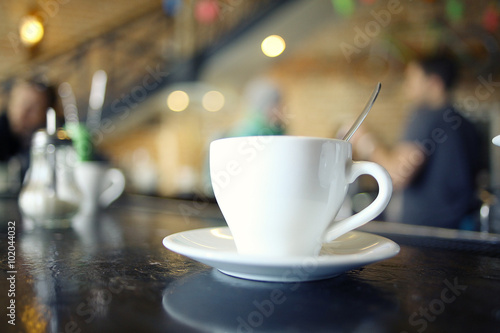 cup of tea at a cafe blurred background