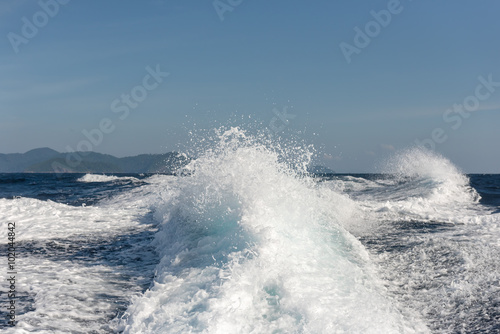 Background water surface behind of fast moving motor boat