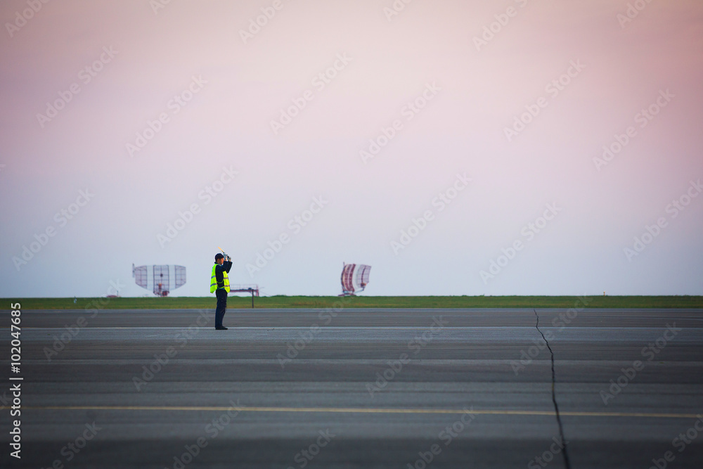 airport staff men on runway