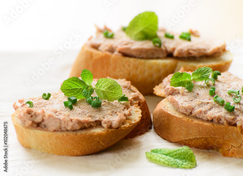 Sandwiches with paste and green onions.
