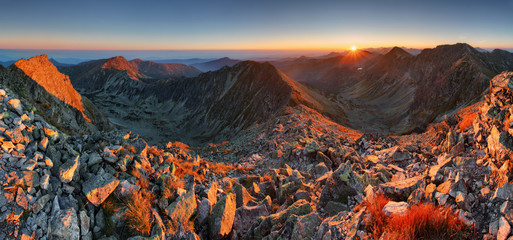 Autumn panorama in high mountain ladnscape with sun