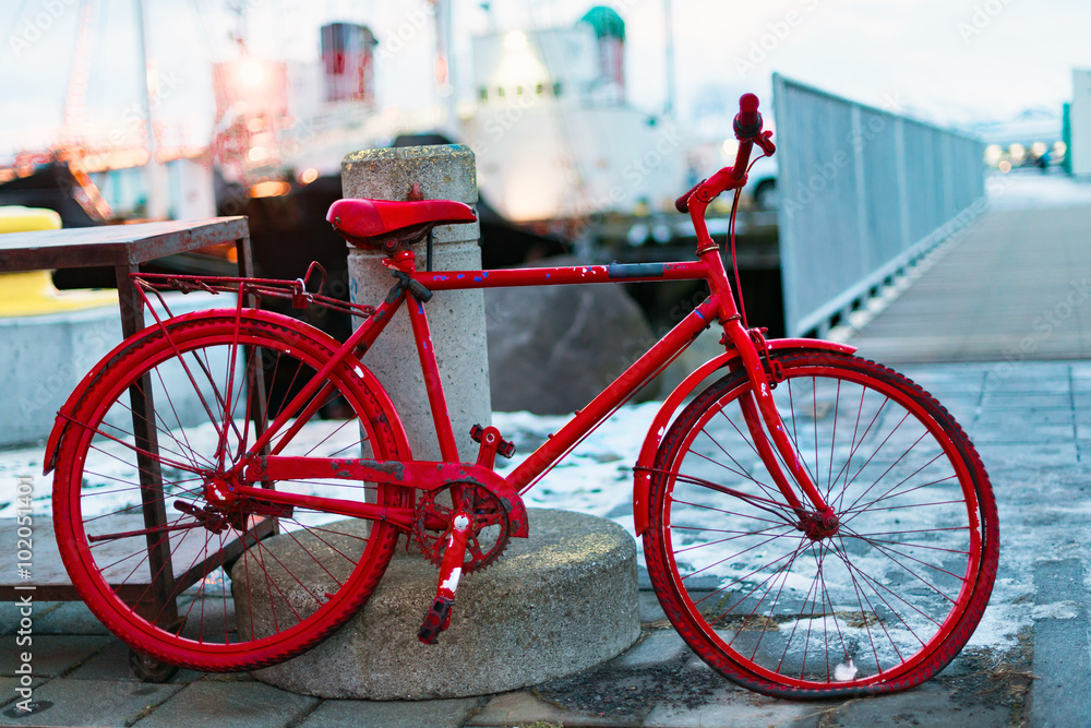 Just a red old bicycle in the harbour