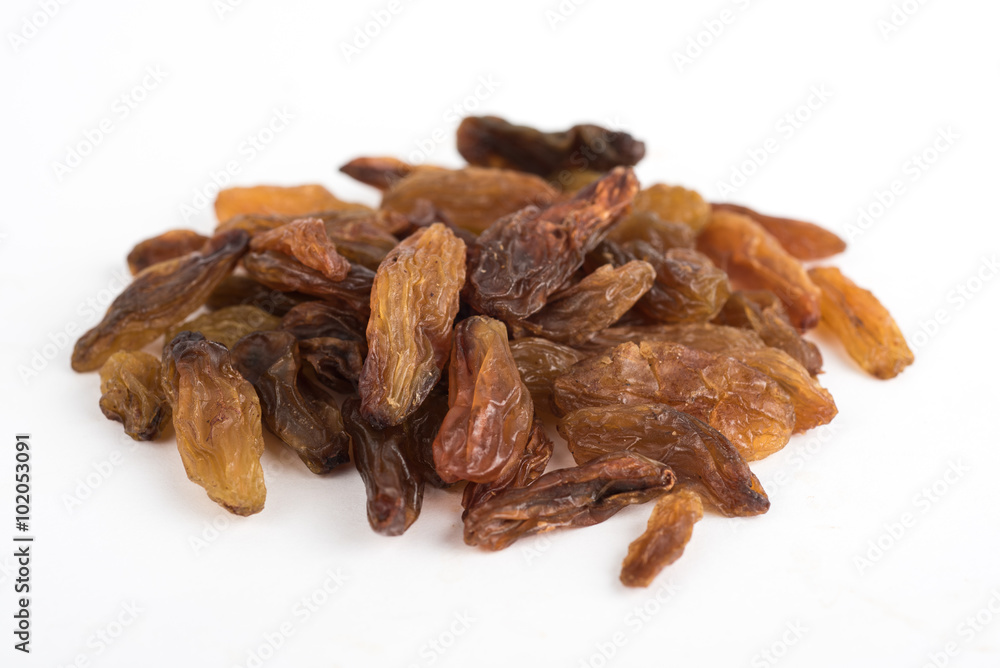 Dried long raisins on a white background top front view