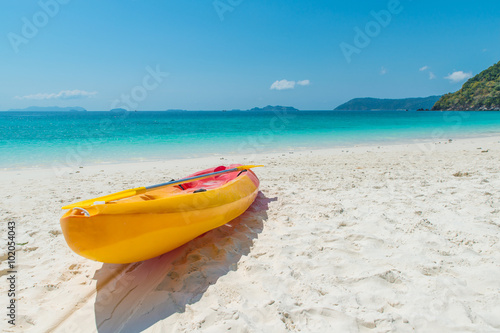 Summer, Travel, Vacation and Holiday concept - Orange kayaks on