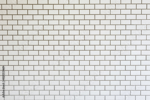White brick wall background in rural room, grungy rusty blocks o