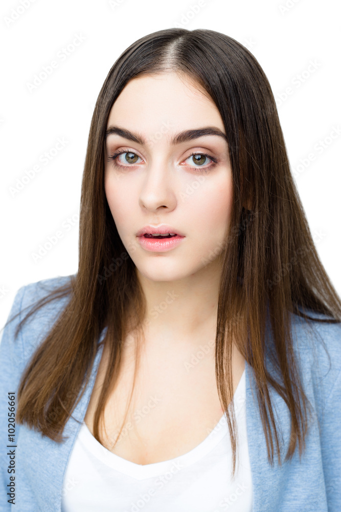 Close-up portrait of surprised beautiful woman in amazement and open-mouthed. Over white background.