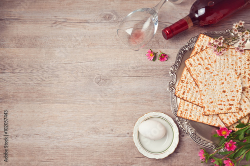 Passover background with matzah, seder plate and wine. View from above photo