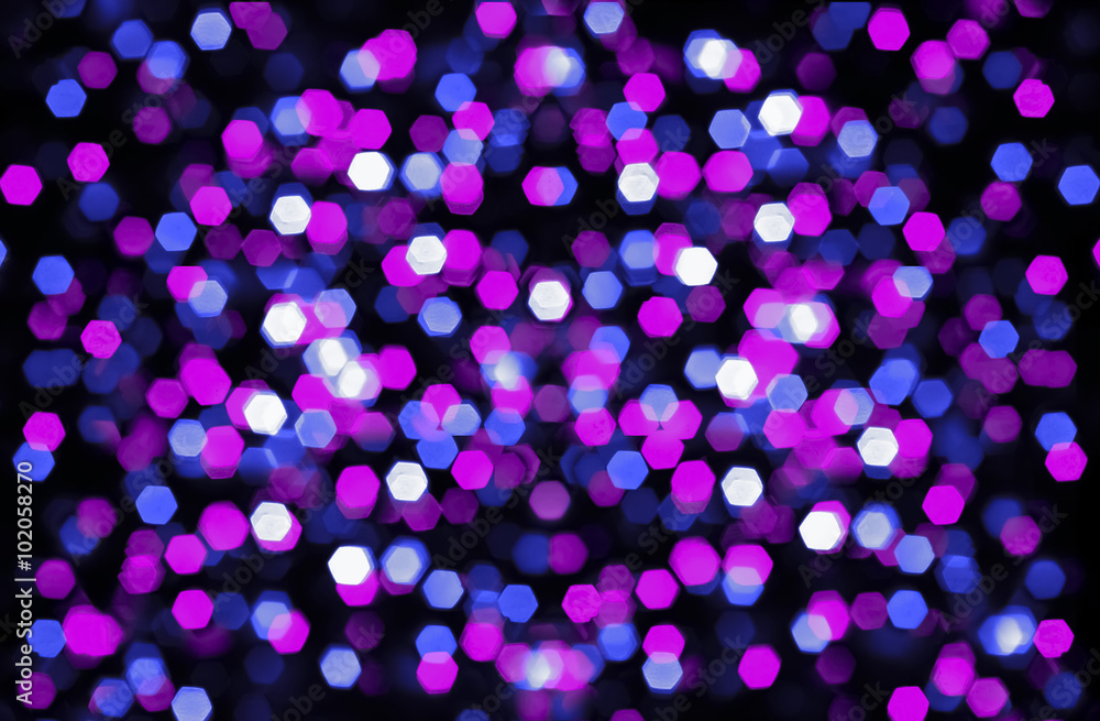 Blurry festive party bokeh with pink and blue lights on black Blurry festive party bokeh with pink and blue lights on black