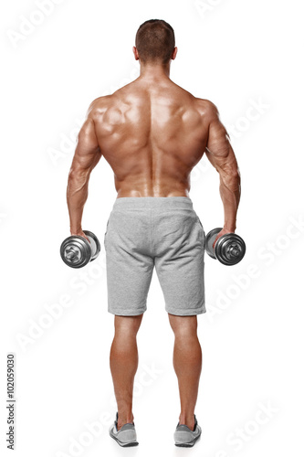 Sexy athletic man showing muscular body with dumbbells  rear view  full length  isolated over white background. Strong male naked torso