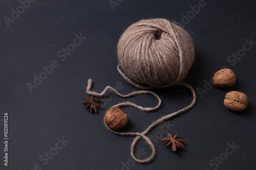 Closeup of yarn clew and walnuts