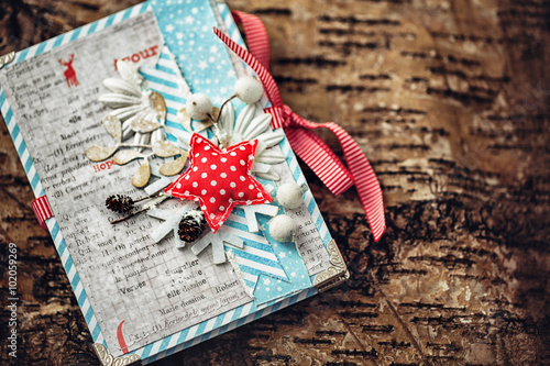 Closeup of photobook  on a wooden texture photo