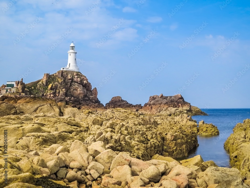 La Corbiere Lighthouse on the rocky coast of Jersey Island La Corbiere Lighthouse on the rocky coast of Jersey Island
