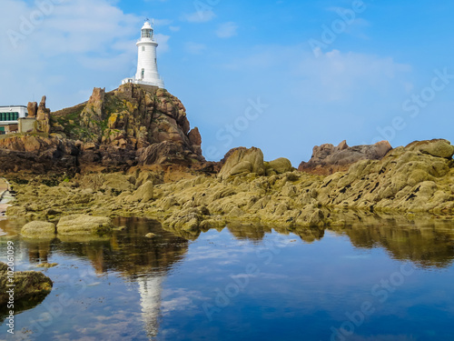 La Corbiere Lighthouse on the rocky coast of Jersey Island