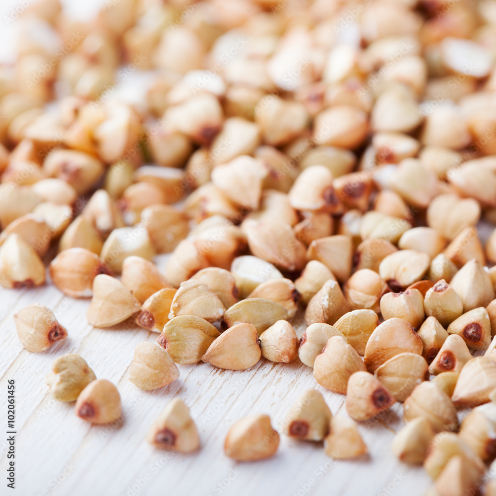Raw green buckwheat groats and young sprouts on white background Raw green buckwheat groats and young sprouts on white background
