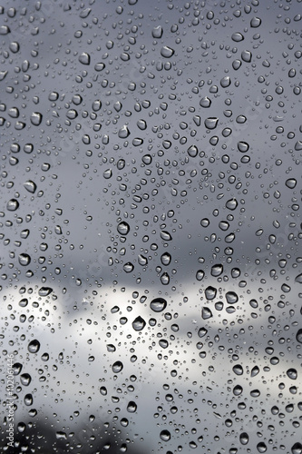 Water drops on a window glass, rainy day