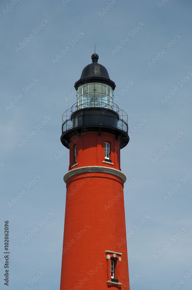 beautiful red Ponce de Leon Inlet Lighthouse against blue sky, Florida, USA