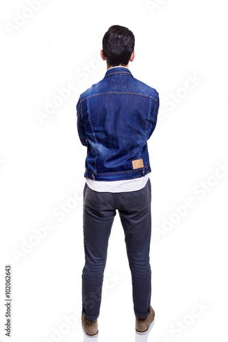 Young casual man standing from back with arms crossed, isolated © cristovao31