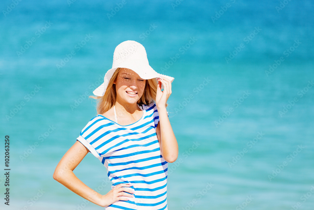 Young woman relaxing on the beach Young woman relaxing on the beach