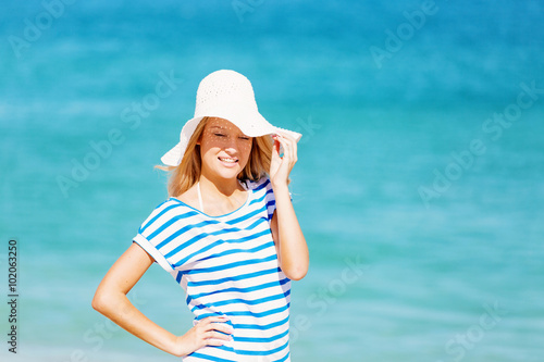 Young woman relaxing on the beach © Sergey Nivens