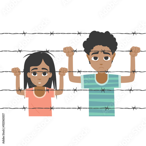 Refugee boy and girl behind barbed wire