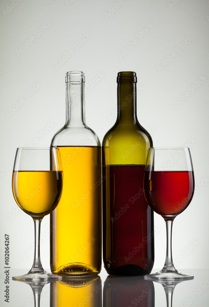 Glass of wine and bottle on white with copy space Glass of wine and bottle on white with copy space