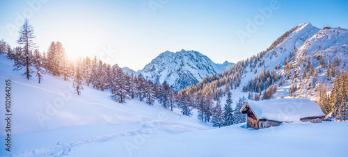 Winter wonderland in the Alps with mountain chalet at sunset © JFL Photography