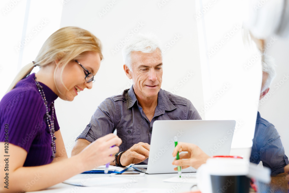 Co-workers working together Co-workers working together