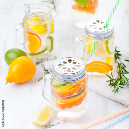 Detox fruit infused flavored water. Refreshing summer homemade lemonade cocktail Cleanse body and burn fat