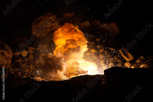 Explosion on the battlefield. Realistic fiery explosion inside an old ruined hall