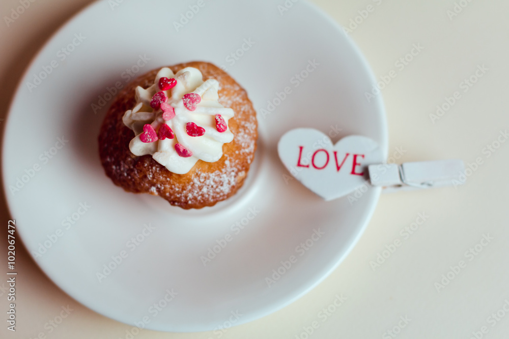 Beautiful cakes cupcakes on a white wooden table from the heart Beautiful cakes cupcakes on a white wooden table from the heart