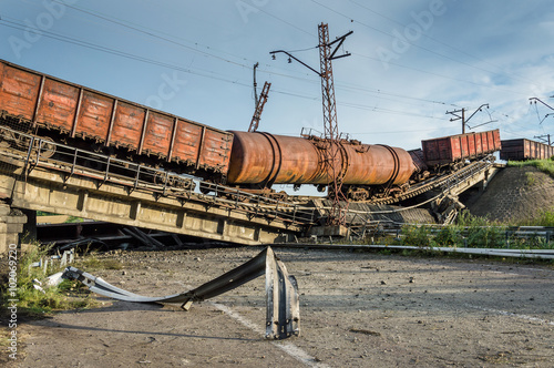 Photography Destroyed bridge with wagons