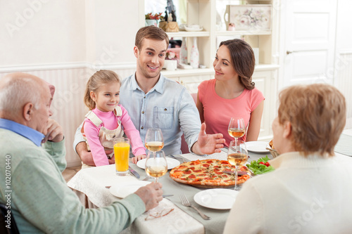 Three generations have dinner together