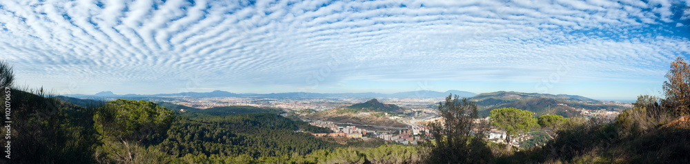 View of Cerdanyola. Striped cloudy sky. Barcelona, Catalonia, Spain.