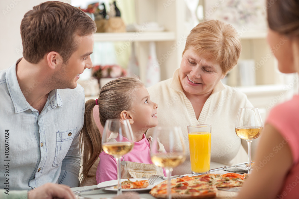 Old lady is celebrating her birthday with family Old lady is celebrating her birthday with family