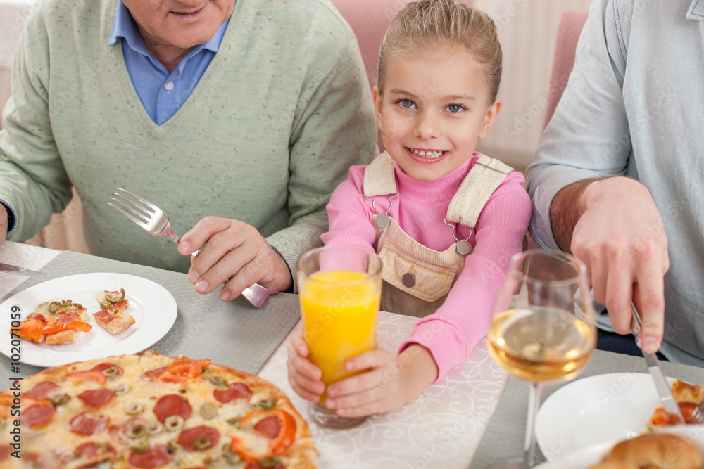 Cheerful friendly family has a lunch together Cheerful friendly family has a lunch together