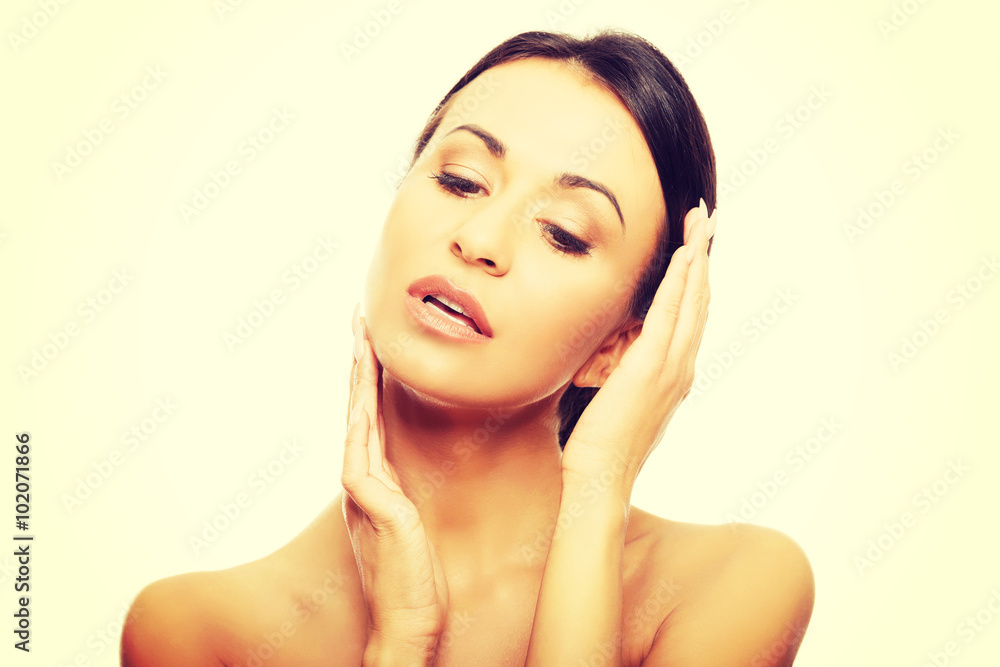 Spa woman holding hand on chin Spa woman holding hand on chin