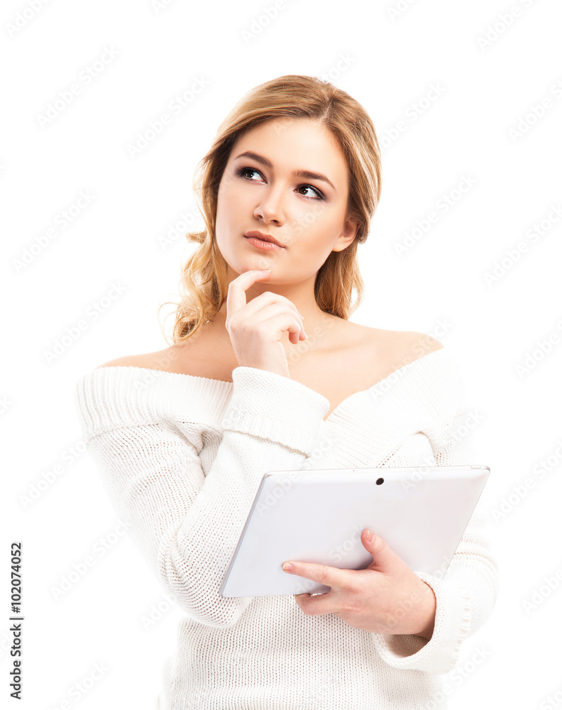 Young and beautiful housewife woman cooking in a kitchen Young and beautiful housewife woman cooking in a kitchen