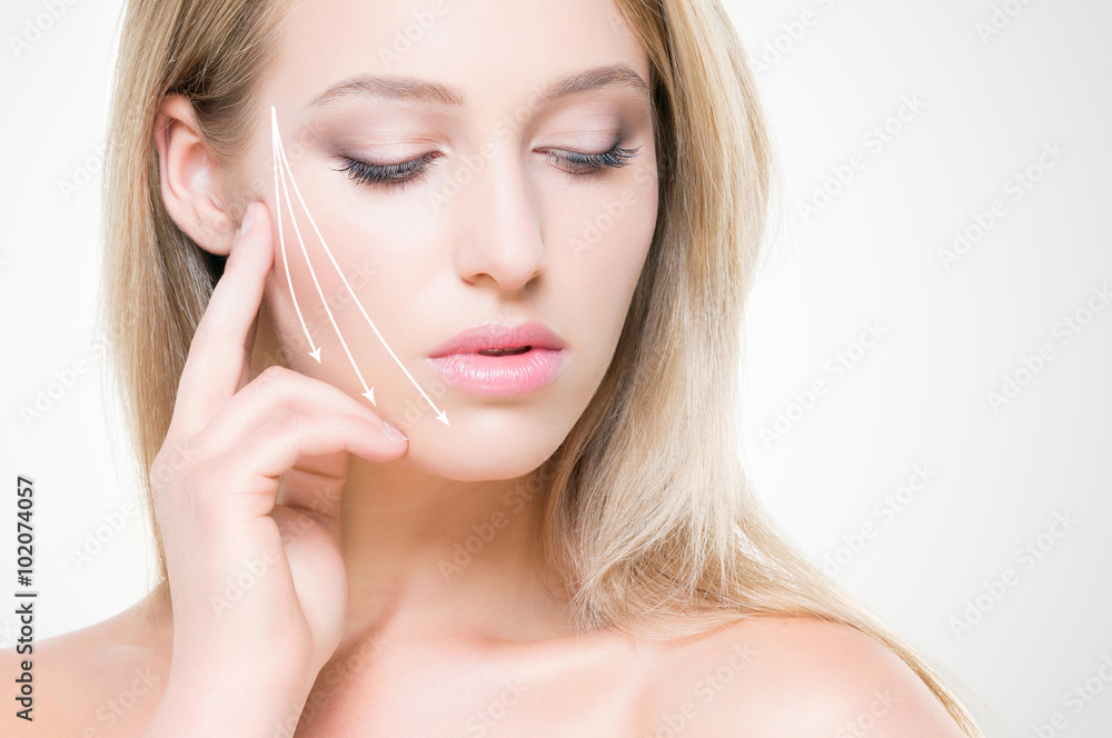 Beautiful and seductive young woman with pure skin on isolated b Beautiful and seductive young woman with pure skin on isolated b