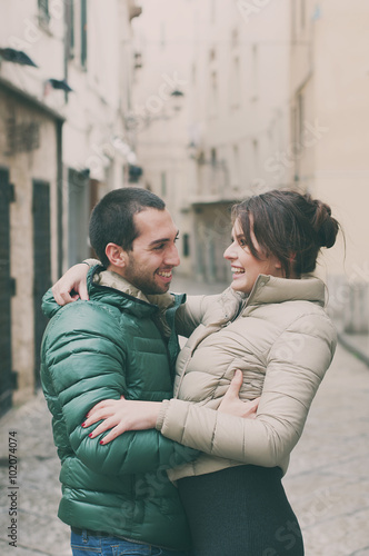 Young couple in love in the small italian city