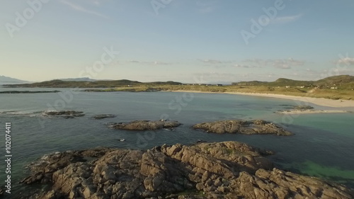 Aerial shot along the beach on the coastline during a sunset at Ardnamurchan, Scotland
 photo