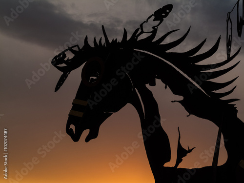 Horse head sculpture at sunset
