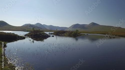 Stunning drone shot in Scotland of Lochan na h-Achlaise by Rannoch Moor on the A83 towards Glen Coe
 photo