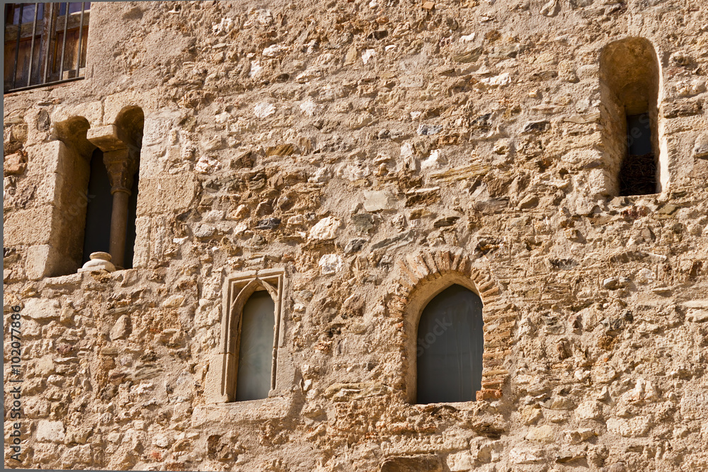 Facade with windows in the romanesque monastery of Sant Cugat