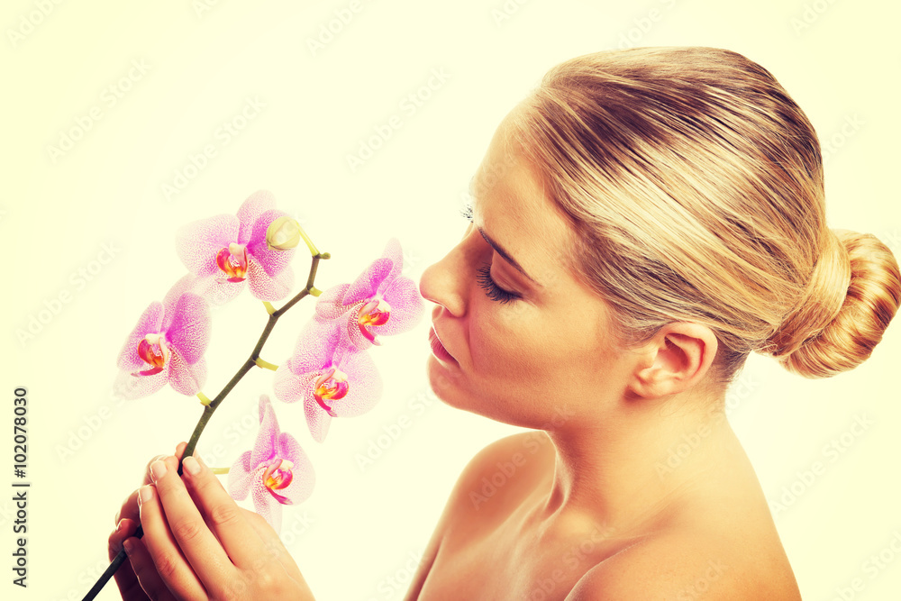 Spa woman with purple orchid Spa woman with purple orchid