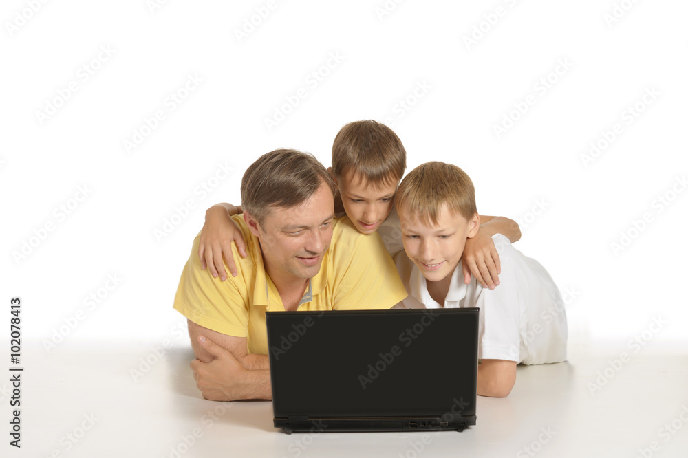 Father with boys with laptop