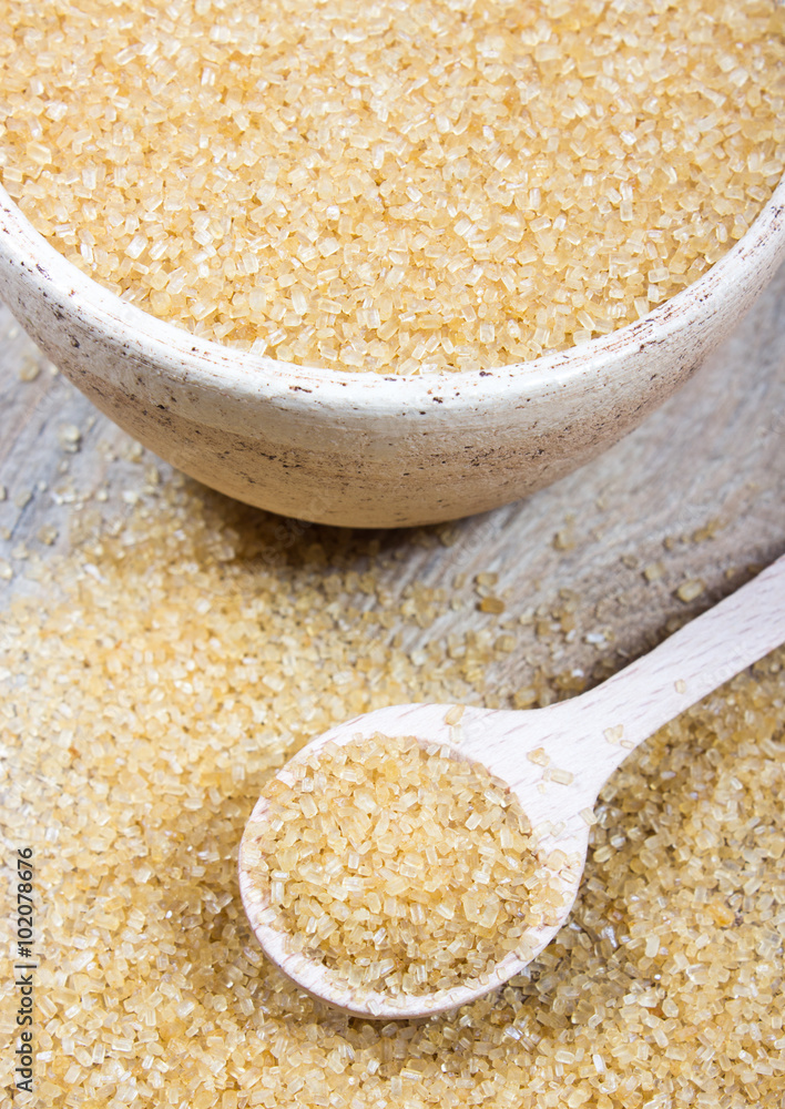 Brown sugar cane on the wooden background. Brown sugar cane on the wooden background.