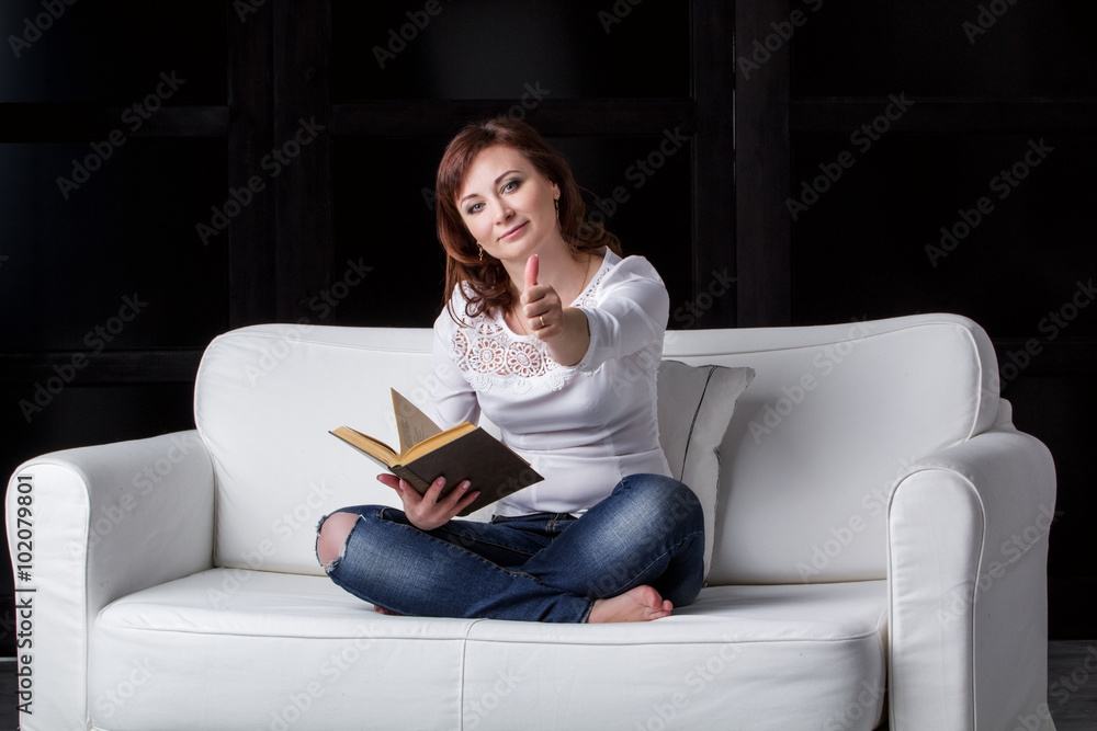 girl sitting on a white sofa girl sitting on a white sofa