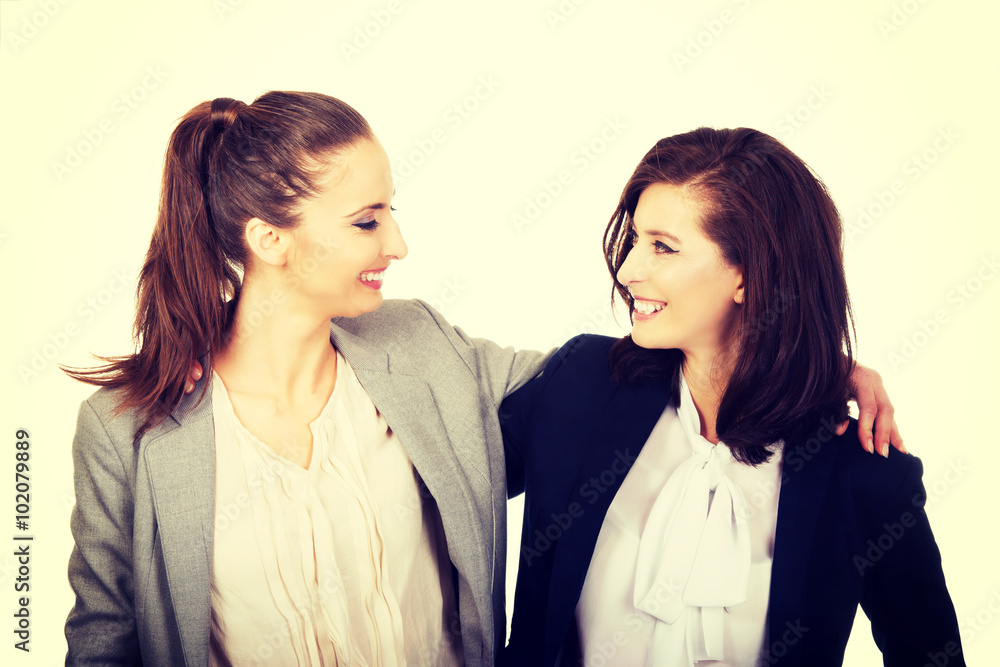 Two women embracing each other. Two women embracing each other.